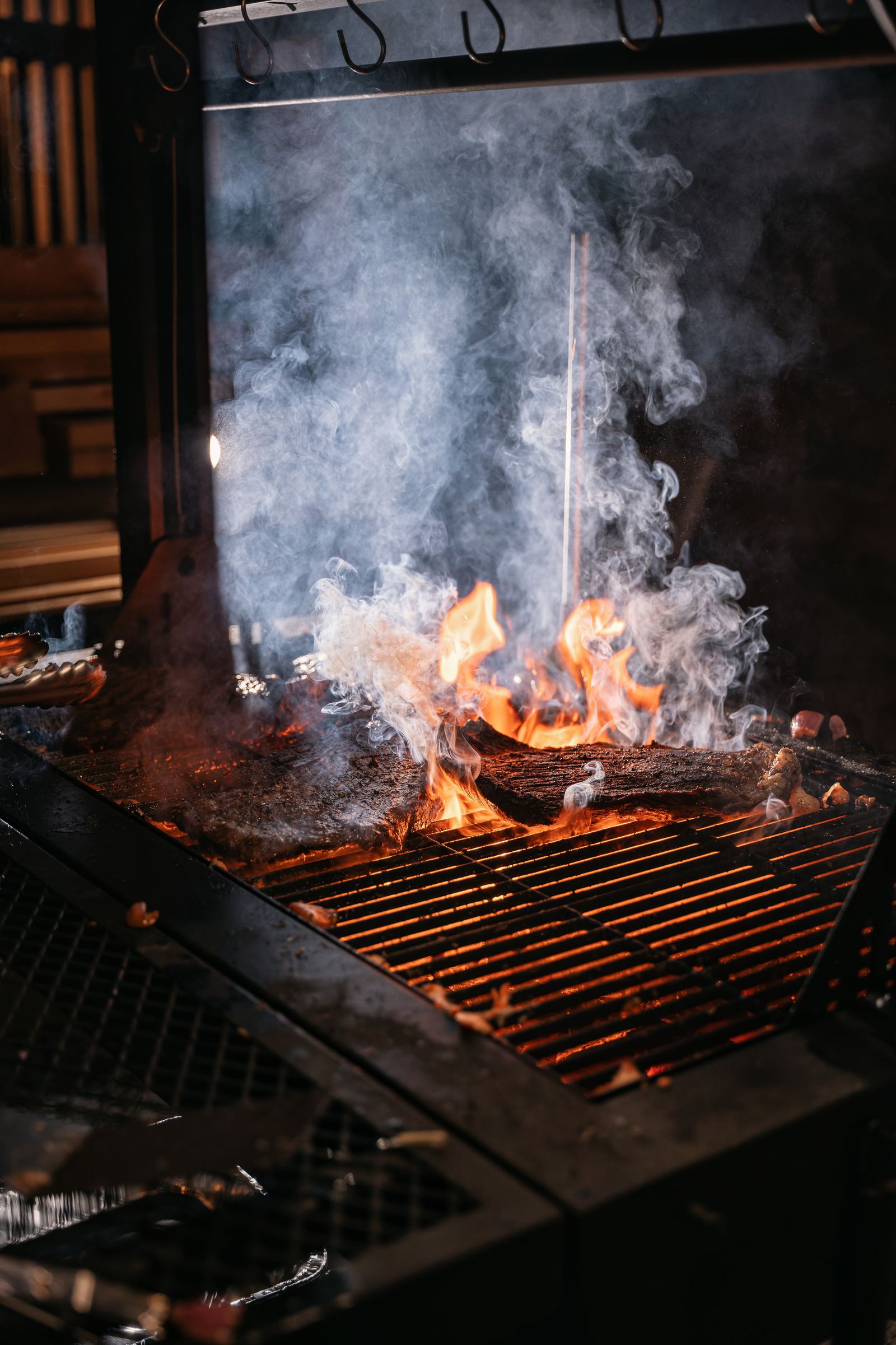 Guests, fire and the long table at the Rosalynn Summer Series dinner on 8 August 2026