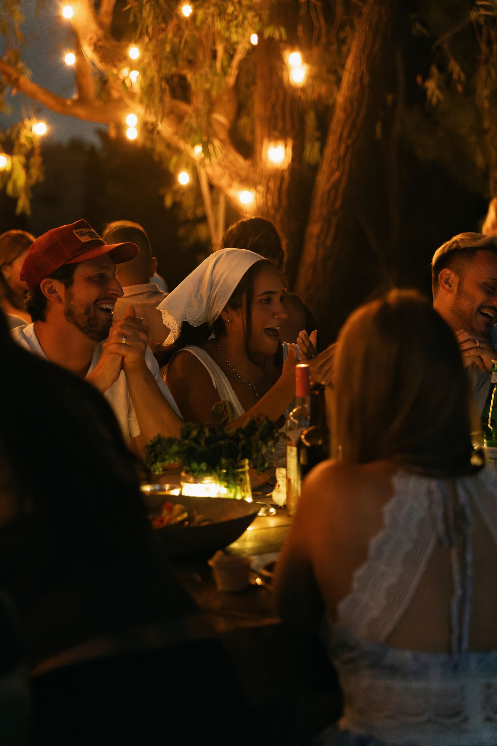 Guests, fire and the long table at the Rosalynn Summer Series dinner on 8 August 2026