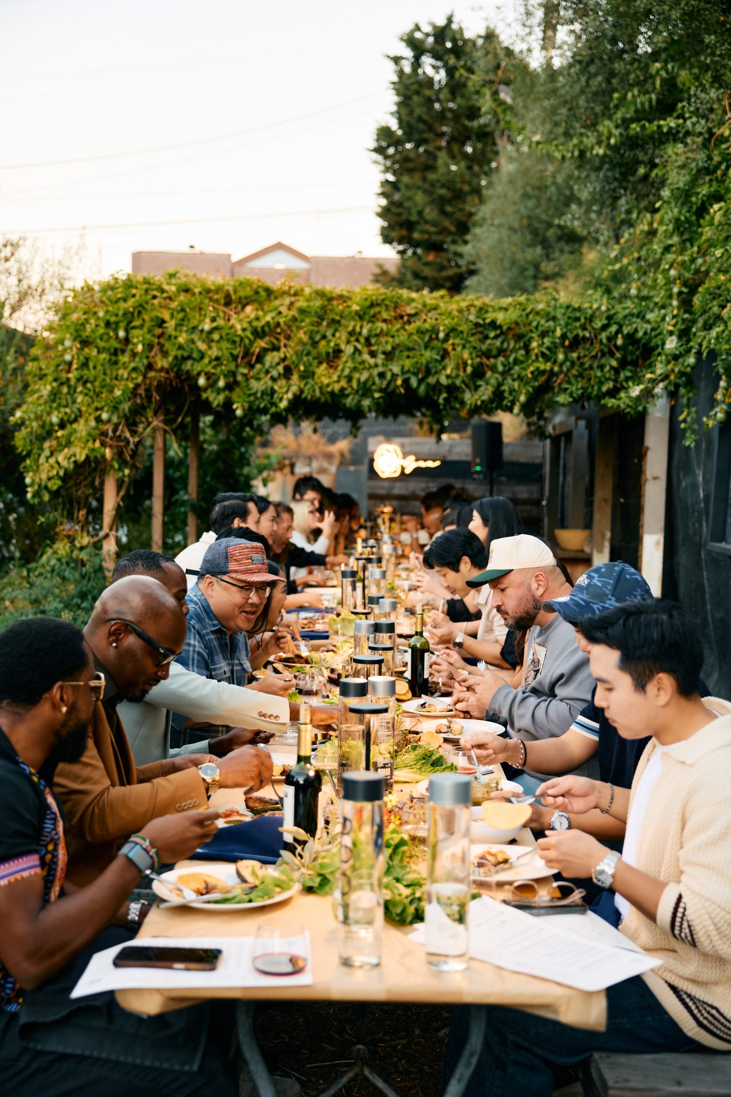 Guests at a Rosalynn long-table dinner in a Los Angeles garden