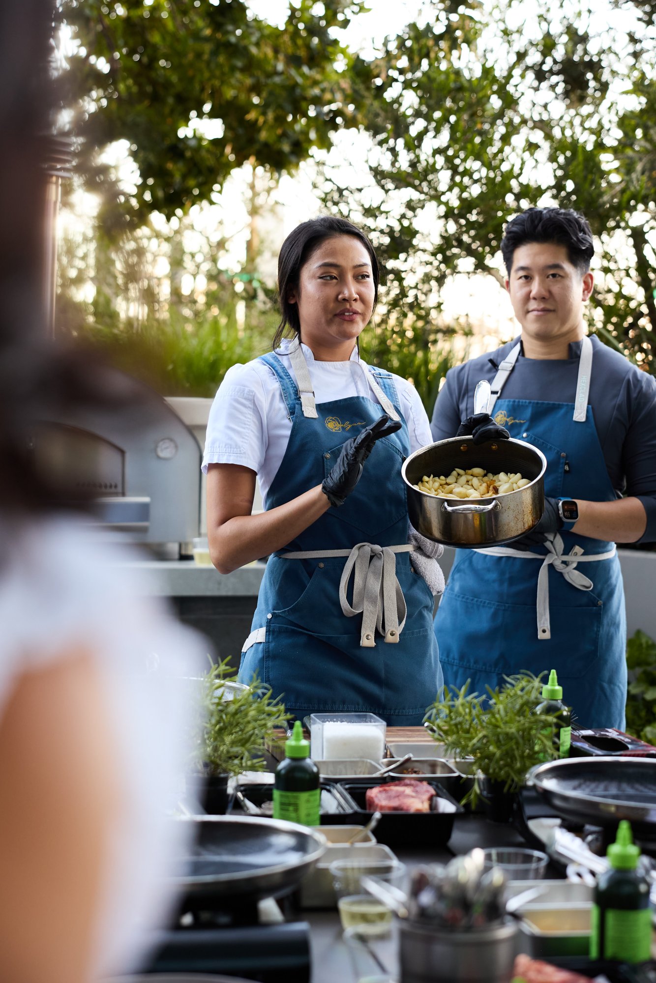 Rosalynn chefs presenting a dish during a cooking class
