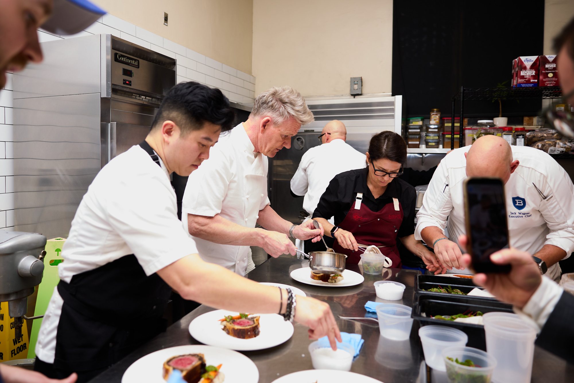 Chef Jasper Lynn and guest chefs plating at a Rosalynn culinary experience